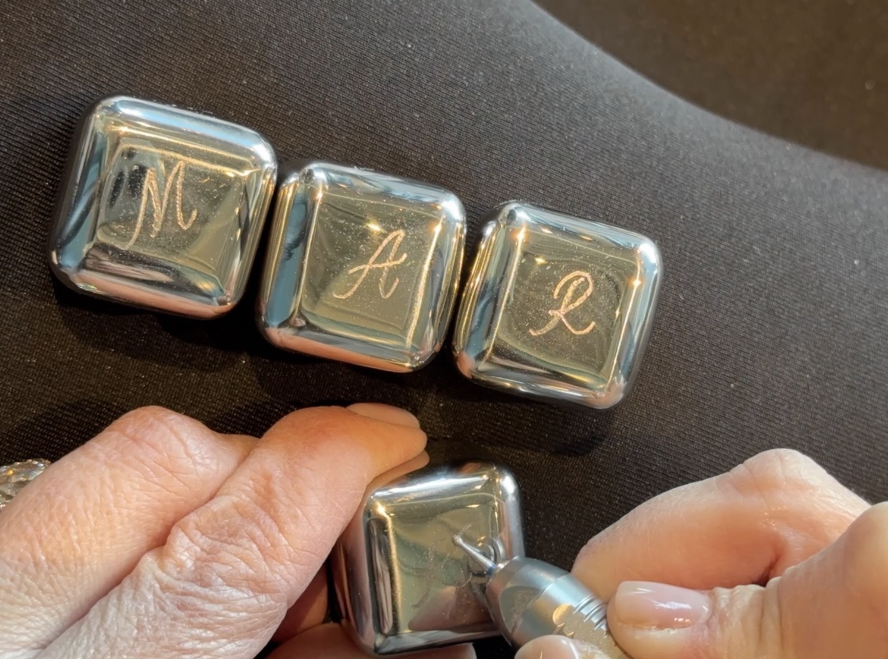 Demonstrating engraving of stones